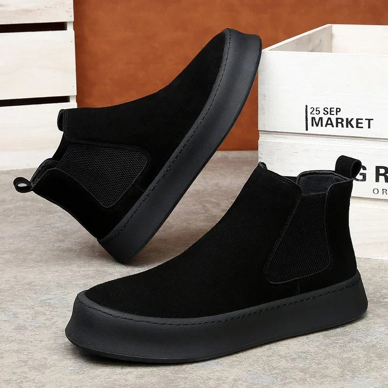 Chelsea boots made of leather.