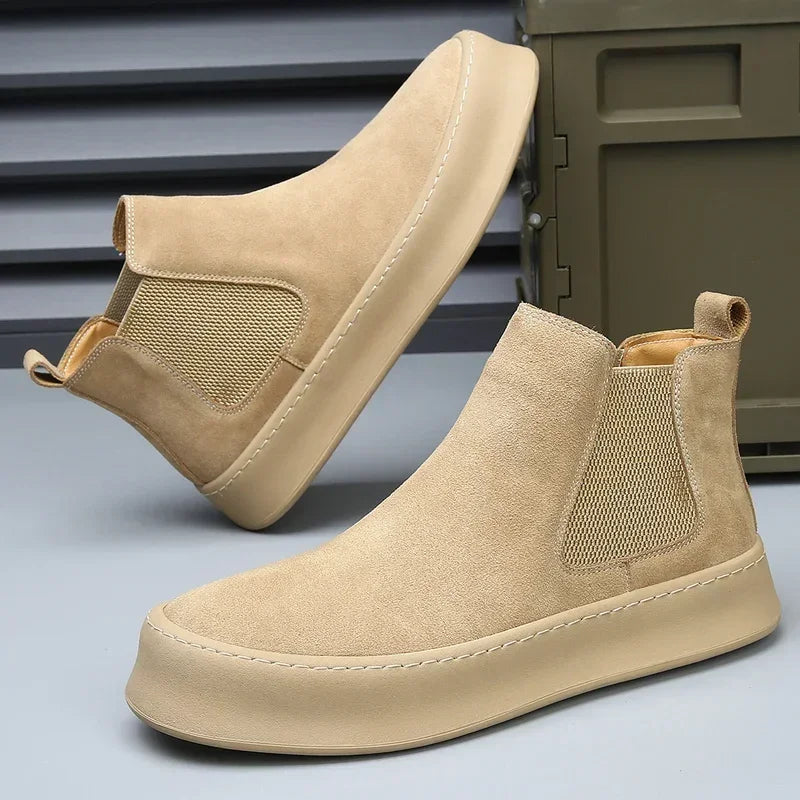 Chelsea boots made of leather.