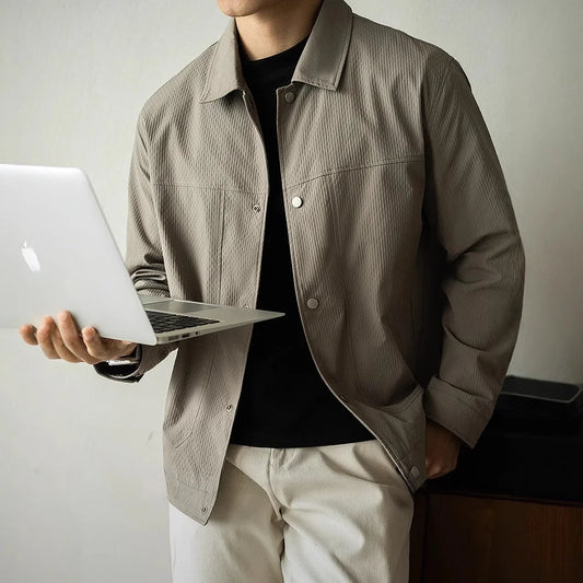 Men's casual, loose-fitting dress shirt with a plaid collar.