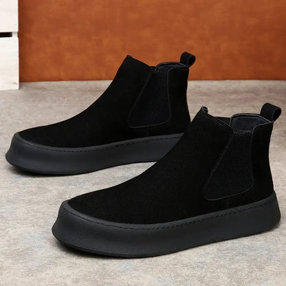 Chelsea boots made of leather.